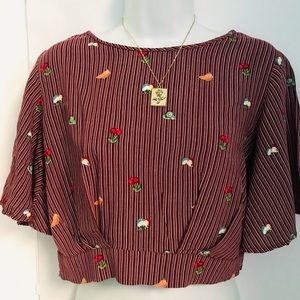Burgundy striped fruity top, with open tied back.
